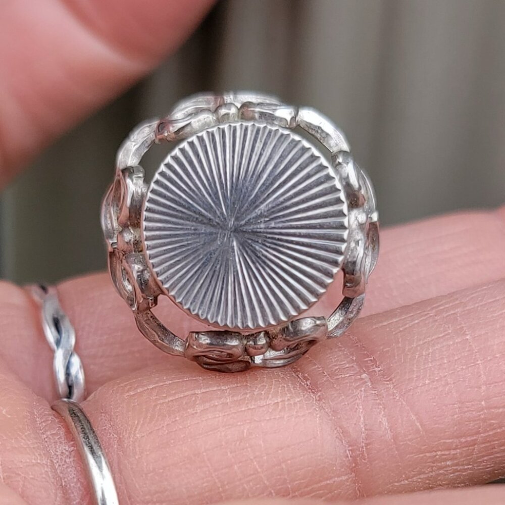 Vintage adjustable silver sunburst ring with ornate filigree details